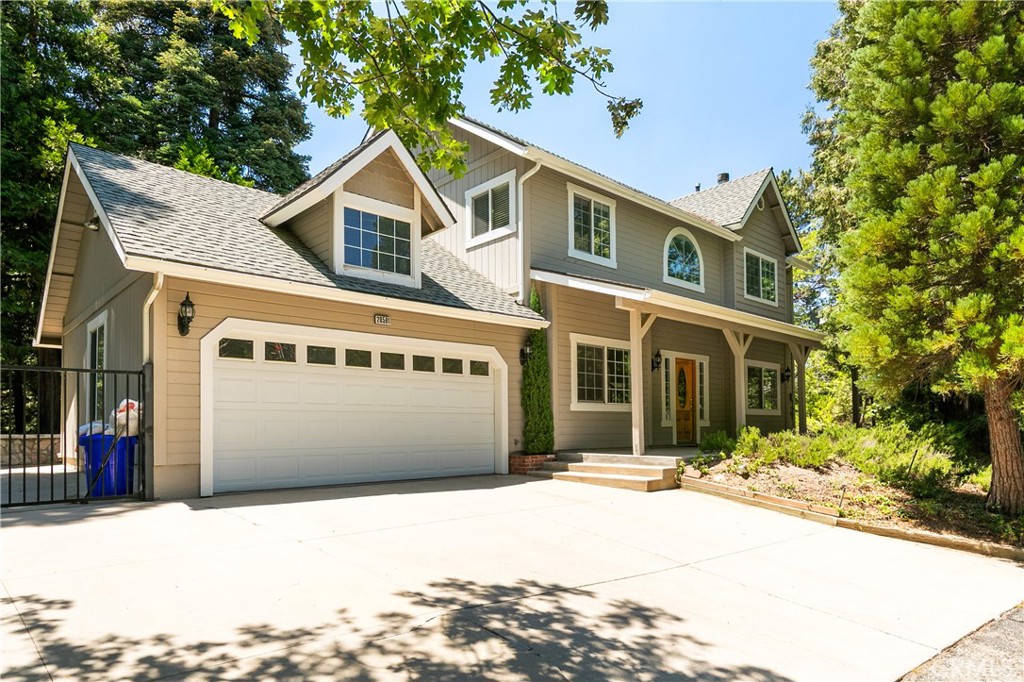 Welcome to “The Trailside Hideaway” — a storybook mountain retreat nestled at the end of a peaceful cul-de-sac, just moments from the magic of Lake Arrowhead and the gateway to Kuffle Canyon. Whether you're seeking quick commuter access via Hwy 18 or a spontaneous walk to lake trails, this location offers the best of both worlds — adventure at your doorstep and convenience around the corner.
This enchanting home comes with full Lake Rights and is surrounded by towering pines and hiking trails, making it an outdoor lover’s dream. Nearly level entry with a gated, extra-long driveway offers room for your boat, RV, or weekend toys, while the oversized two-car garage provides tons of storage for all your gear. Only a few gentle steps lead to a charming covered front porch — the perfect perch for morning coffee.
Inside, the sun-soaked living room is both cozy and expansive, framed by picture windows and anchored by a classic brick fireplace. Just off the main living space, you'll find a dreamy home office with French doors — ideal for remote work or easily transformed into an extra guest room. The dining area opens to a kitchen filled with warm knotty pine cabinets, exuding rustic charm and function.
Step out back to your private fenced yard, where a concrete patio and grassy lawn offer the perfect backdrop for summer evenings under the stars, lawn games, or roasting marshmallows.
Upstairs, you’ll discover three serene bedrooms and two bathrooms. The spacious primary suite is a retreat in itself, featuring a walk-in closet and a private en suite bath with dual vanities.
Whether you're looking for a full-time haven, a part-time escape, or a vacation rental with character and charm, The Trailside Hideaway invites you to embrace the mountain lifestyle in comfort and style.