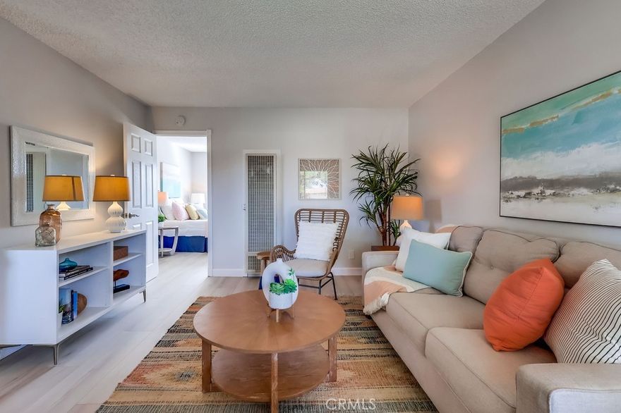 Updated Condo! Top Floor End Unit in Long Beach. Step inside this freshly updated second story corner unit in the Clair Del Condos, with new flooring and fresh paint giving it a bright, move-in ready feel from the moment you arrive. The thoughtfully designed 1-bedroom, 1-bathroom layout maximizes its 590 sq. ft., creating a space that feels light, comfortable, and easy to call home. The kitchen is equipped with a gas stove and refrigerator, while the living areas are filled with natural light. The spacious bedroom features mirrored closets, and the bathroom includes a tub/shower combo with a privacy window that adds both brightness and comfort. Located at the back of the complex, this private corner unit enjoys a quiet setting with the convenience of having its own parking right by unit. The Clair Del community provides an array of desirable amenities, including a swimming pool, barbecue area, and two clubhouse spaces—one featuring a pool table and ping pong, and another that can be reserved for private events. Residents also have access to two convenient laundry facilities. The low monthly HOA fee covers water, gas, trash, and upkeep of the common areas, making this a practical and affordable option. There is  also a pet-friendly policy welcoming up to two pets under 25 pounds. Its prime location places you close to Lakewood Country Club, Bixby Knolls, and the Long Beach Exchange (LBX), with shopping, dining, and entertainment just minutes away. Perfect for a first-time buyer ready to invest in homeownership, a downsizer seeking a low-maintenance lifestyle, or an investor looking for a turnkey rental opportunity, this Clair Del condo is an excellent find.