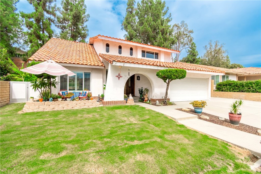 Welcome to 19873 Calle Granada, Walnut — a spacious 4-bedroom, 3-bathroom home offering approximately 2,015 sq ft of comfortable living space, ideally set on a 9,200+ sq ft lot in a highly desirable neighborhood.
This thoughtfully designed two-story residence sits at the end of a quiet cul-de-sac, providing privacy and a peaceful setting. The bright living room boasts high ceilings, large windows with elegant shutters, and an inviting dining area. The functional kitchen, appointed with cherry wood cabinets, overlooks the expansive backyard, while the cozy family room is perfect for gatherings with seamless access to the outdoor space. Upstairs, the roomy primary suite features soaring ceilings, two ample closets, a private full bathroom, and beautiful views, creating the perfect retreat.
Additional highlights include double pane windows throughout, updated central heating and air, an attached 2-car garage, a long driveway with RV parking on the side, and a newer roof. The generously sized backyard showcases mature landscaping and a sparkling pool that has been recently re-serviced, offering the perfect setting for entertaining or relaxing. With its spacious lot, the property also provides J/ADU potential, ideal for multi-generational living or additional rental income. Plus, its south-facing orientation helps keep the interior naturally cool and comfortable throughout the year.
Conveniently located near top-rated Walnut schools, parks, shopping, and freeway access, this home blends everyday functionality with long-term potential.
Don’t miss the opportunity to own this beautiful cul-de-sac home with J/ADU potential in one of Walnut’s most sought-after neighborhoods!