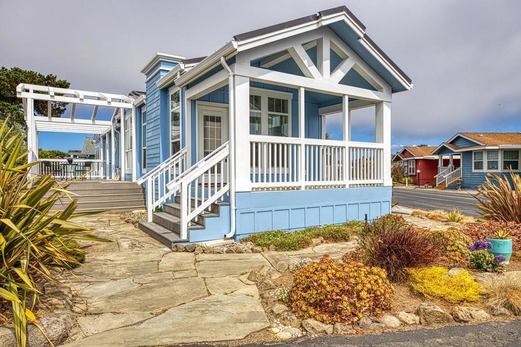 New price for this adorable home in an amazing location in the park,w/ views of the ocean from the kitchen,living room,desk area,not to mention both decks!This home runs parallel to the side of the park,w/ views of Longs Marine Lab. This home has it all! Fresh, new exterior paint, and most of the interior is newly repainted also. 2 over sized decks to enjoy,an outside kitchen to entertain your guests with a great flow from inside your adorable home to the beautiful outdoors. Smell the ocean air from all rooms of this home. As you enter the front door,you are greeted w/vaulted ceilings,new flooring throughout, electric fireplace, an adorable kitchen, with an Island, and white cabinetry.There are built-ins also to store some of your special pieces. The hall comes with an area for a desk/office that has Corian counter tops, a niche for storage, and special items, and a stackable washer/dryer for convenience. There are 2 bedrooms, and a beautiful bathroom that has extra storage,hooks & builtin bench.Many upgrades to this home include dual pane windows,a metal roof,on demand water heater,even an outdoor kitchen for your entertaining the list goes on,you will love it!It feels very Nantucket,like it belongs on Martha's Vineyard!Come take a look!Call listing agent re age restrictions.