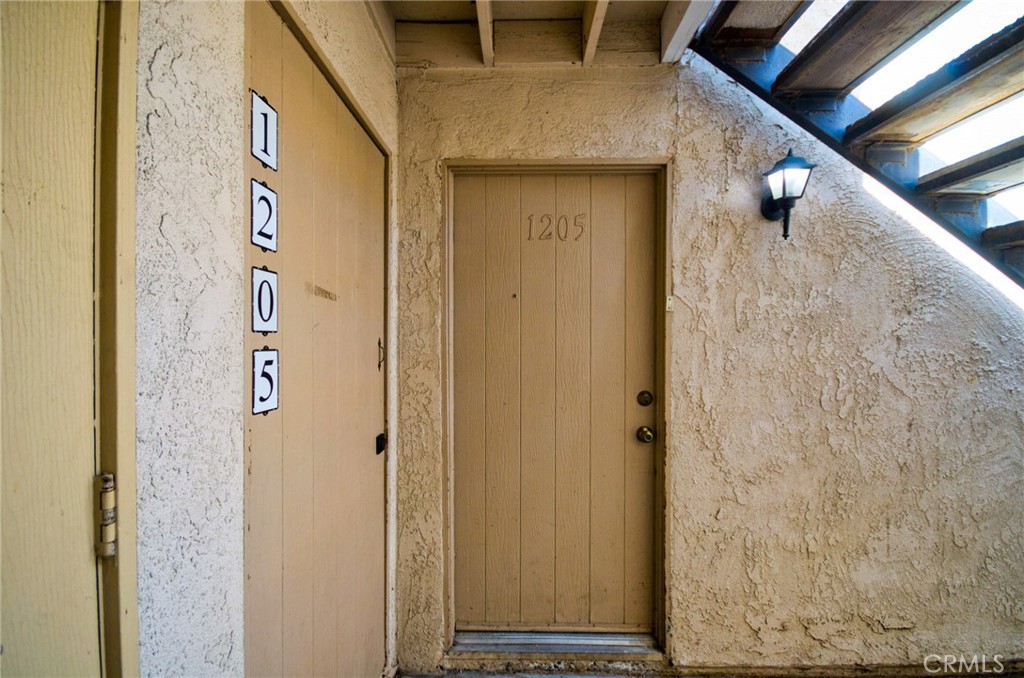 Lower level unit with 2 bedroom/ 1 Full bath. Upgraded kitchen and bath. New Laminated wooden floor installed in bedrooms. Close to parking and near pool area. Open floorplan with private patio. Spacious bedrooms with large closets and plenty of storage. Cinnamon Tree amenities include pool, spa, barbeque area, club house and laundry. Conveniently located across from the Placentia Civic Center, Police Station and Public Library. Alta Vista Country CLub, parks, schools, shopping and 57/91 freeways are all nearby.