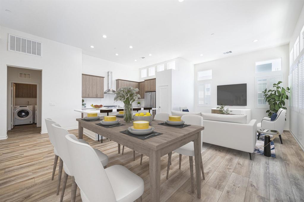 Welcome to this immaculate 3-bedroom penthouse, thoughtfully designed for comfort and style. Your private elevator opens directly into a home filled with premium touches, including custom shutters, built-in closets, a wine cabinet, and bookcases. The open-concept kitchen features KitchenAid appliances, quartz countertops, vaulted ceilings, and beautifully crafted details. The bathrooms are generously sized, featuring glass-enclosed showers and a river rock floor in the primary suite. Start your morning with coffee or unwind in the evening on your wraparound terrace, and added privacy with no neighbors above or on one side. Practical features such as a tankless water heater and epoxy-coated garage flooring make everyday living even easier. The community offers a pool, hot tub, parks, and a fire pit lounge for relaxing or gathering with friends. All this is just blocks from shopping, dining, a grocery store, and your favorite coffee spot. The building is in the process of receiving updated exterior touches, adding to the overall charm and curb appeal. Select photos are virtually staged for illustrative purposes