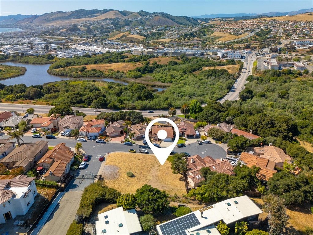 Fabulous RARE lot in the exclusive gated neighborhood of Mar Brisa in Grover Heights! One of the larger lots available at just over 8,000 sf. and has amazing views. Ready to build, fully designed and recent city approved plans are included for a 2604 sf 3 bedroom 2.5 bathroom home with an office and three car garage. Including an option to install a lift/elevator in garage. Grading, soil analysis and city approved landscape plans are complete. Building Permit has been extended until 11/19/2025. This property is in close proximity to the beach, golf courses, wineries, breweries, restaurants, shopping, transportation and more. Come grab this gem and start building your dream home today!