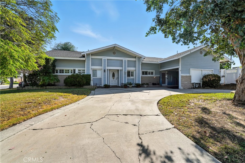 Charming corner lot home with pool, spa and paid solar. Welcome to this spacious 3bedroom, 2 bath gem in a beautiful, quiet, and sought after neighborhood. Sitting on a massive 11,270 square foot lot. The open concept layout features a family room with a brick fireplace and a 2nd fireplace in the living room, perfect for cozy evenings. The kitchen boasts a large island, ample cabinet space and abundant natural light throughout. The primary bathroom includes a large soaking tub, while the home is enhanced with double pane windows, shutters, copper plumbing and a 200amp electrical panel and central AC and heat. A separate laundry area adds convenience. Step outside to your private backyard oasis with a covered patio, built in BBQ, heated pool and spa ideal for entertaining. Situated on a corner lot with circular driveway, theres plenty of parking for guests. Paid solar panels (and no electric bill for the sellers) this home combines efficiency with lifestyle.