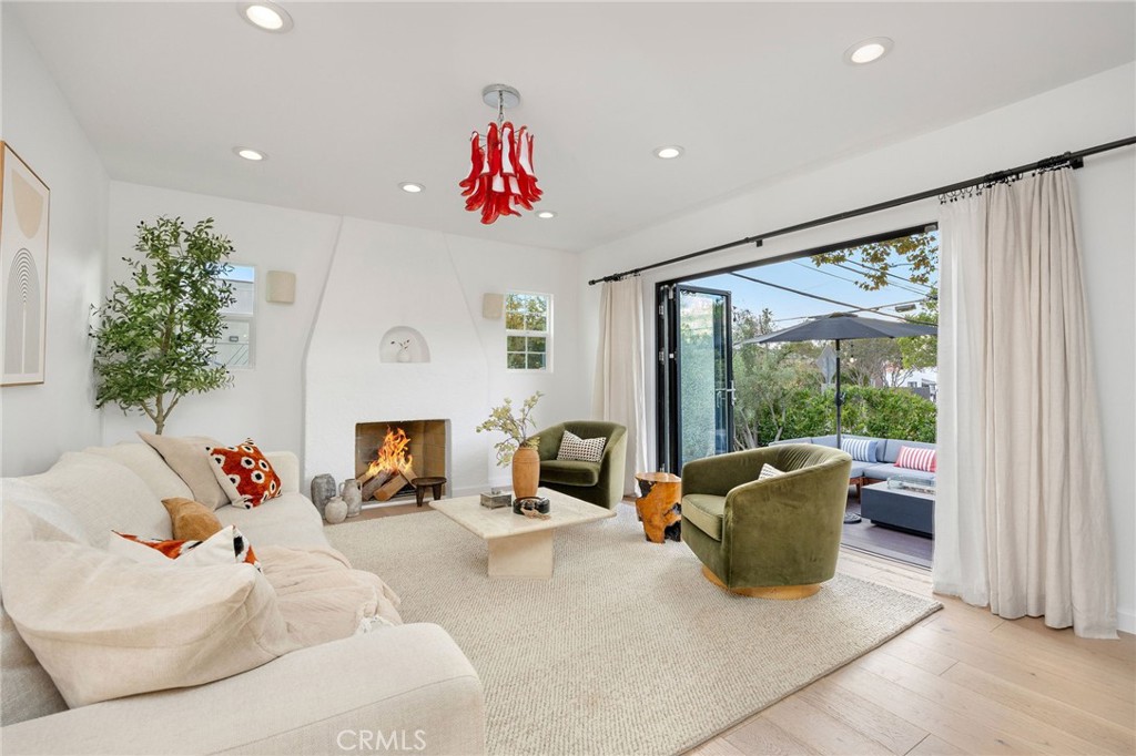 Nestled in a coveted Los Angeles neighborhood, this beautifully updated 2-bedroom, 1-bath California bungalow blends timeless character with modern sophistication. Enter through the private, hedged, and gated front porch to discover sunlit interiors with designer finishes and an effortless flow between the formal living room, dining area, and newly remodeled kitchen with center bar — perfect for entertaining. Gorgeous light oak floors run throughout, adding warmth and style.
A stunning new front deck extends directly from the living room, creating an ideal setting for indoor-outdoor living and effortless hosting. Surrounded by lush landscaping, it offers a private retreat for morning coffee or lively evening gatherings.
The primary bedroom features a custom built-in closet, while the second bedroom opens to a spacious backyard oasis with soaring bamboo and curated plantings — a serene escape in the heart of the city.
All of this, just blocks away from cultural favorites like Galerie Jeffrey Deitch and David Zwirner, everyday convenience at Sprouts, and celebrated dining destinations including Tartine, Sightglass, and The Benjamin.