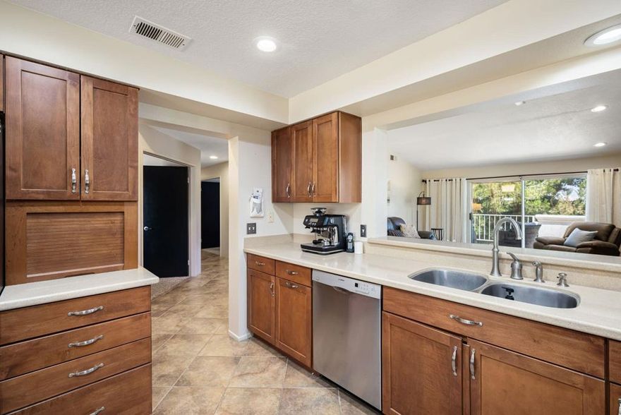 Awesome Views!! This Beautifully upgraded and meticulously maintained, 3bedroom /2.5 bath condo/home, is the perfect home for entertaining!  Either in the upgraded Kitchen with its extensive custom built soft close cabinetry, stainless appliances, and 3 sun-filled Bay Windows, allowing light to flood into the Kitchen and Breakfast Nook; or Outdoors on the front, south facing patio, or the extensive back patio, shaded by Torrey Pines, overlooking the lush green Golf Course and Pond on the 16th Fairway with fabulous views of the Mountains.  The entire home is light bright and airy with Cathedral Ceilings, large windows and sliding Glass Doors.  The large, comfy, and tastefully furnished, Living/Dining Room with its stone facade fireplace, mounted flat screen TV and Soundbar, comes complete with comfy leather Sofa and Recliner to enjoy Movie nights. Glass Slider doors open out to the private patio with Spectacular Views of the Mountains and Fairway.  Just a few steps down the hall transports you to into the privacy or your Primary Suite also boasting high ceilings and a glass slider allowing more views of the mountains and fairways.  The bright, and sunny, Ensuite Guest Bed and Bath is beautifully appointed and situated down the hall on the other side of the home allowing the 2 Primary Bedrooms space and privacy. The entire home is tiled in 12x12 tile flooring with bedrooms covered in soft neutral tone carpeting consistent with the relaxing palette and overall vibe of this warm clean, calm & relaxing home. This is truly a beautiful home and the very best of Resort Living with your Building and Grounds Maintenance, Tennis, Pickleball, Full Fitness Center, 29+ Pools & Spas, Cable, Wi-Fi, 24hr Gate Guarded, Roving Security and more, included in your HOA Dues! Golf on Desert Falls Country Clubs 18-hole Scottish Championship Links Course is on a pay as you play basis or choose to opt in on a membership. Desert Falls Country Club has it all!  Within walking distance to restaurants & shopping, and just a few miles drive to Acrisure Arena, McCallum Theatre and El Paseo with upscale shopping, Designer Boutiques, Galleries and Fine Dining. This upgraded 3-bedroom home is move in ready and not to be missed! Short Term leasing currently allowed. Call today for your private tour!