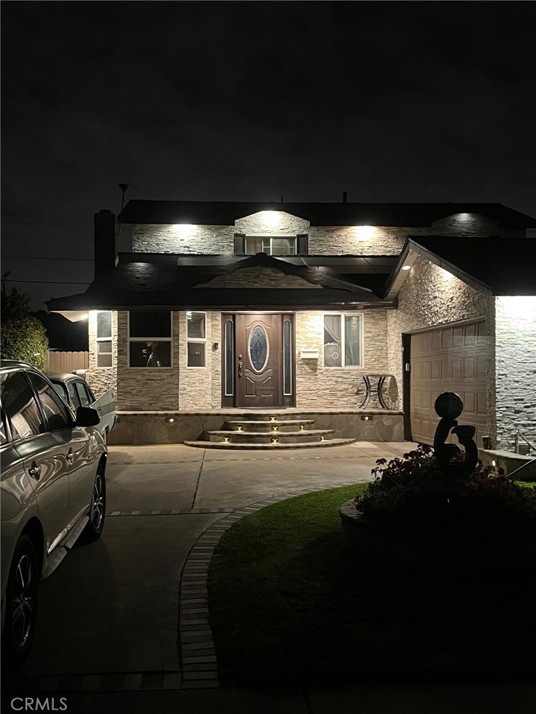Beautiful stone work has been done outside of the front of the house. 3 bedrooms downstairs with an additional 3 bedrooms upstairs. Each floor has it's own bathroom. Backyard has been built for entertaining and relaxing. Close to Knotts Berry Farm and Disneyland.