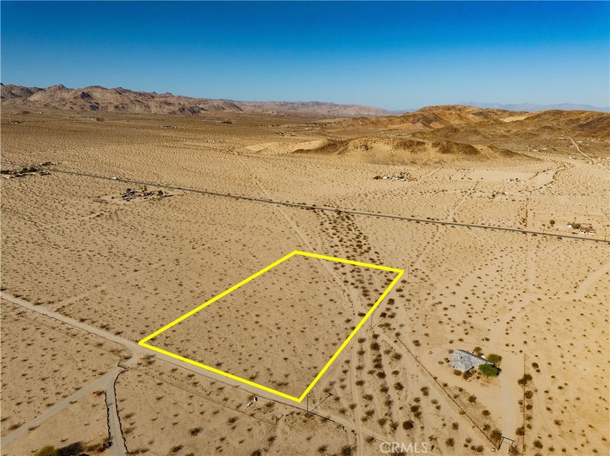 (APN 0612061090000) This lovely CORNER LOT of 5 acres is located in the serene Copper Mountain East area of 29 Palms! Just a short distance from paved Lear Avenue, ease of access, utilities that appear to be nearby, and a lack of protected desert plants on the property mean this lot is ready for your next dream construction project (buyer to verify all utilities and land use). As you approach the parcel, you will love the vast swaths of open desert that surround you here, and appreciate that any neighbors are well spaced, preserving the relaxing vibes of the desert. As you walk the land, let your imagination run wild with the possibilities of this generous space. Copper Mountain paints an impressive view nearby to the east, while the desert horizons stretch on into the vast distance all around you. Imagine the peaceful and private desert getaway you could create here – and at only approximately 10 minutes to either 29 Palms or Joshua Tree, not only is this location secluded, it's also a convenient base for any Hi-Desert adventure you could desire. Come visit this beauty for yourself and see why this would be a great location for your desert dream home!