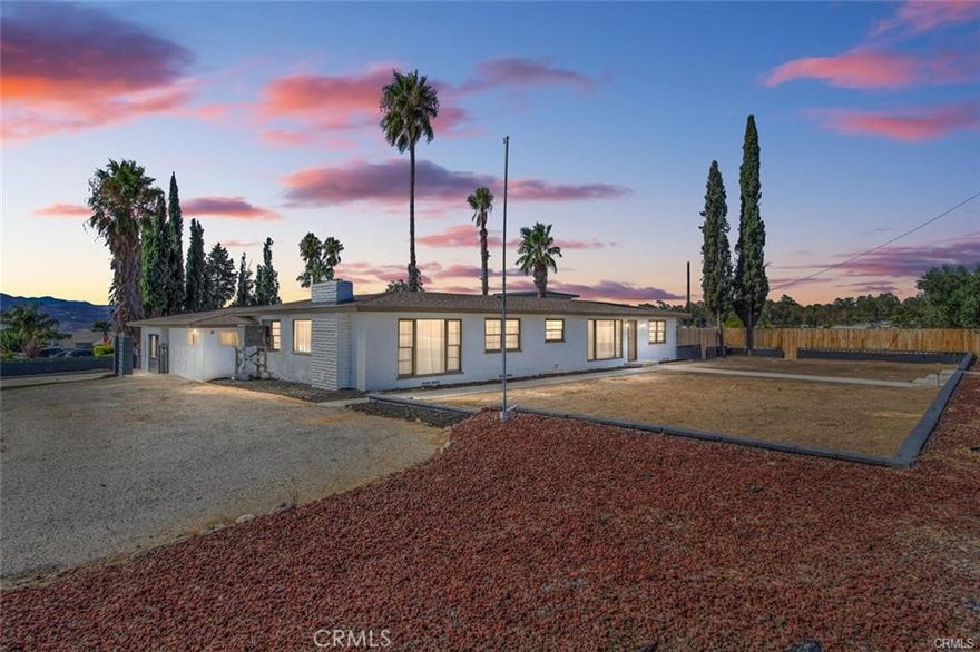 This Beautiful Home is located in the corner of Wilson and 20th street has 4 spacious bedrooms with fans and 2 baths in the main house and lots of extra's amenities. This promptly is near shopping center, schools and several churches. In over half an acre you will find ample space for RV and Toys, a 4 Car detach garage that can accommodate cars or trucks .With very large picture perfect windows, stainless steel appliances, beautiful fireplace in the family room , separate laundry area And a combination of new flooring thru out the house of laminate and carpet is the place to call home . A Great bonus area that can serve as a private office, Guest room, craft area on top of the garage area with a beautiful view of mountains. The Backyard boasts a a pool with a cemented backyard, palm trees, wooded fence and a cover patio for BBQ or get together. With a separated ADU that can be used mother-in-law quarters, rental, guest house endless possibilities and use your imagination. Great property in a Great location with so many amenities it is price to sell, Show and Sell!!!!