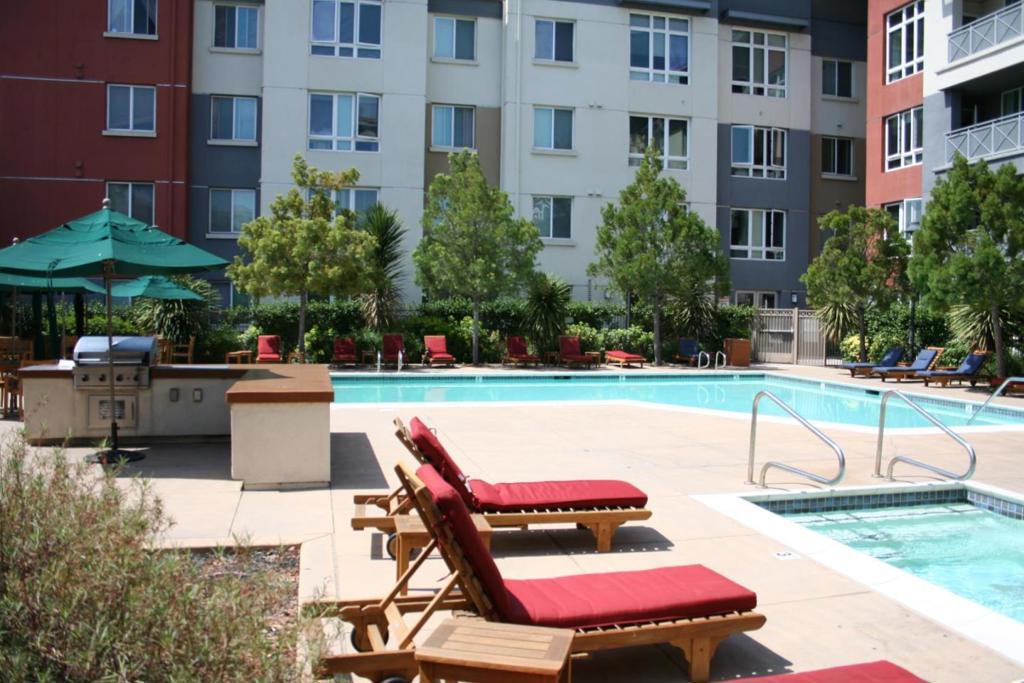 Welcome to this eight-year-old condominium in a secured building, located just minutes from 880, 680, and 237. This 2 bedrooms 2 bath unit represents Milpitas living at its finest. With 1,146 square feet of well-organized living space, this home includes hardwood floors, carpet in bedrooms, double pane windows, stackable washer/ dryer, a walk-in closet in the master bedroom, two large walk-in halls closets, two ceiling fans, an alarm, and two assigned parking spaces. The home chef will enjoy the fully outfitted kitchen with modern, high-end stainless steel appliances including a gas range, dishwasher, over-range microwave, and refrigerator. The open floor plan includes a living room, breakfast bar, and dining area. This home is perfect for entertaining and living the modern lifestyle. HOA requires a $250 deposit and a minimum of one week's notice prior to moving in. HOA will conduct a walk-through of the common areas before anything can be moved into the unit.
