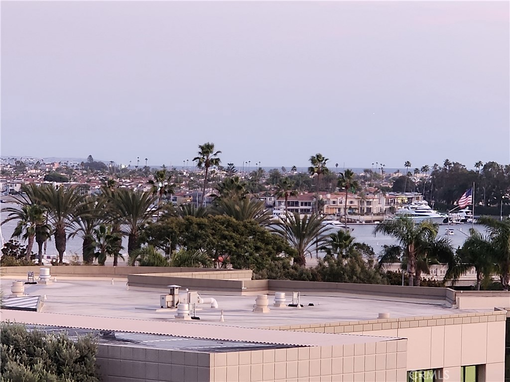 Don’t miss the opportunity to lease in the beautifully maintained, gated community of Villa Balboa, ideally located within walking distance to the beach, Balboa Peninsula, a large city park, and Hoag Hospital.
This spacious 1,304 sq. ft. condominium is filled with natural light, featuring a skylight and expansive sliding glass doors that open to two private balconies. Enjoy calming ocean breezes and bay views from both balconies, perfect for indoor-outdoor living and entertaining. The open-concept living room includes a cozy gas fireplace and direct access to the larger veranda balcony, offering a peaceful place to relax or host guests. The home includes two generous primary suites, each with its own full bathroom and private balcony. One suite offers a separate shower and soaking tub for added comfort. Additional features include two dedicated garage parking spaces, cabinet storage, and room for bicycles.
Within the gated community, residents have access to exceptional amenities including two swimming pools, two large hot tubs, tennis and pickleball courts, a fitness center, and a spacious clubhouse with a full kitchen available for private gatherings. There's also a welcoming community center with a library, computer workspace, and retreat areas, plus beautifully landscaped grounds with BBQ areas and walking paths that lead to a scenic bluff just outside the gates. This is a rare opportunity to enjoy upscale coastal living in one of Newport Beach’s most desirable communities.