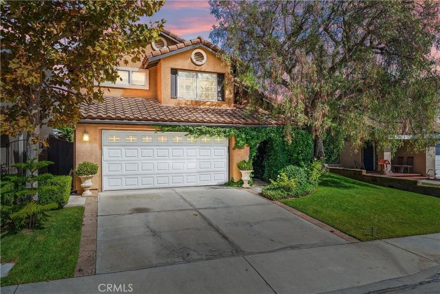 Absolutely Stunning 4-Bedroom Home in the Sought-After La Tierra Tract of Rancho Santa Margarita! Welcome to this beautifully upgraded residence nestled within the desirable Tijeras Creek Golf Course neighborhood. This exceptional home showcases tons of upgrades, including the addition of a spacious fourth bedroom upstairs and newer luxury vinyl flooring on the upper level. Step into the elegant living and dining rooms featuring soaring vaulted ceilings, travertine flooring, 6-inch baseboards, and double doors that open to a serene side courtyard—perfect for outdoor dining or a morning coffee. The entry greets you with a Spanish-style wood door with a speakeasy, setting the tone for the home’s timeless character. The remodeled kitchen is a true centerpiece, boasting granite countertops and backsplash, white cabinetry, a Bosch dishwasher, a cozy breakfast nook, and a charming Dutch door leading to the backyard. The adjacent family room offers a welcoming fireplace with a wood mantel and large windows that fill the space with natural light. Downstairs also features a tastefully updated powder room and a convenient laundry room with direct garage access. Ascend the custom wood and wrought-iron staircase to discover a luxurious primary suite with vaulted ceilings, a walk-in closet, and a spa-inspired ensuite with dual quartz vanities and a travertine walk-in shower. Three additional bedrooms and an upgraded full guest bath complete the upper level.

Step outside to your private backyard oasis featuring a covered patio, built-in BBQ island, synthetic turf, custom hardscape, and lush landscaping—ideal for entertaining or relaxing under the California sun. Additional highlights include a two-car attached garage, PEX repipe, and access to all Rancho Santa Margarita Association amenities—including the Lake, Lagoon, Amphitheater, community events, parks, swimming pools, and more! Did I mention the award wining schools, and proximity to amazing shopping centers and restaurants? This shall not last long!