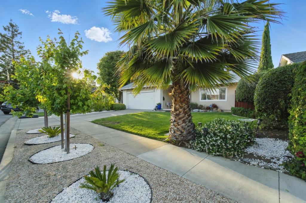 Discover this updated and meticulously cared-for home, in a highly desirable cul-de-sac. This home offers convenient access to vibrant downtown Campbell, local markets, and major freeways. Top rated schools: Capri Elementary, Rolling Hills Middle, and Westmont High School. Step inside to a spacious foyer leading to a formal living room, featuring vaulted ceilings and picturesque views of the expansive backyard. The main level features a separate dining area, a convenient half bath, and a large kitchen that opens to comfortable living space. This home offers four bedrooms in total, with a private master suite downstairs boasting serene backyard views. The upper floor provides three additional sunlit bedrooms and a versatile den. With 2.5 baths, this home combines elegance with practical living. Recent updates includes a brand new roof, newer kitchen appliances, and Closet World closets in each bedroom. The home is equipped with a dual-zone HVAC system (2021), energy-efficient double-pane windows, and reliable copper plumbing. The large, private backyard is a true highlight, featuring updated pavers and a meticulously maintained garden bursting with lemon, Asian pear, and fig trees, complemented by ten majestic cypress trees, offering a tranquil escape. A Must See!!