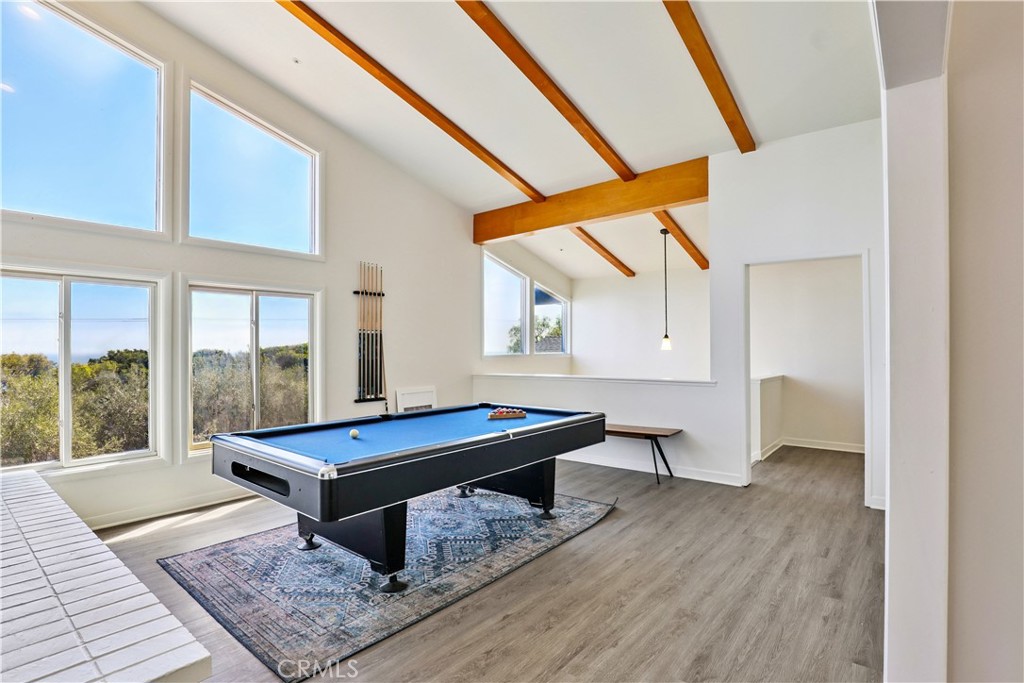 Set in the backdrop of the opulence of the coastline where Malibu meets the sea. This six bedroom and four bathroom home is nestled in a spacious beautifully landscaped lot defining a serene private retreat. Private rooms, all will enjoy the freedom and privacy with unobstructed panoramic ocean views. Step inside an open concept living space filled with natural light warming your welcome and high ceiling with lots of windows framing the Pacific ocean, sailing boats and other ocean scenery. The second-floor family room invites you to cozy up and enjoy the relief from your stresses. Unwind while enjoying the peaceful blue sea stretching out to the horizon. Built with elegance and functionality in mind. The gourmet kitchen is fully equipped for the gourmet cook to create fabulous gastronomical delights for your holiday gatherings and friends and family. In the dining room just off the kitchen is perfect setting for intimate dinners or family festive gatherings. The dining area deck faces a green landscaped backyard of 1.6 acres with persimmon and fig trees. Outdoors is a balcony inviting you to breathe in the cool sea breeze and the sunsets legendary to the Malibu coastline. Additionally a living room, reception room, and separate laundry room . Downstairs, every room has sliding doors to access the patio. Create lifelong memories with friends in this exquisite place. This Malibu gem is a true sanctuary feeling like a getaway everyday with unforgettable moments. Unlimited parking on the street.
