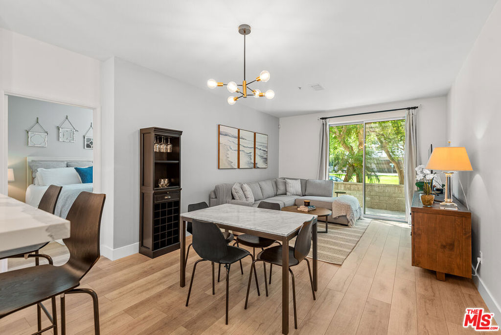 Beautifully renovated, front-facing, single-level 2-bedroom, 2-bathroom condo in the Waterstone community with views of Crescent Park. Enjoy an open floorplan with large windows, recessed lighting, and a spacious, updated chef's kitchen with a breakfast bar and adjacent dining area. The bright living room opens to an oversized wraparound terrace with direct views of Crescent Park and convenient access from both the living room and second bedroom perfect for relaxing or entertaining. The primary bedroom features a spa-like en-suite bathroom and a generous walk-in closet. Additional upgrades include new floors throughout, in-unit laundry, central HVAC with Nest thermostat, two parking spaces, and a separate storage closet directly outside of the unit. As a resident, you'll have access to the Centerpointe Club, which features a fully-equipped gym, a sparkling pool, a relaxing spa, a private screening room, a business center and conference rooms. The Resort fitness center and pool are also available for use. Nearby, the Runway at Playa Vista offers even more conveniences, including a Cinemark Movie Theater, Whole Foods, a farmer's market, additional dining options, and shopping.