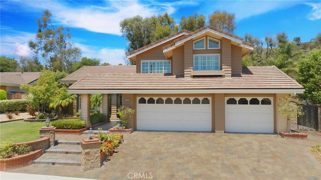 Welcome to 6335 E Smokey Avenue, a stunning two-story home in the highly sought-after Mabury Ranch community. With 4 bedrooms and 3 bathrooms, with a large bonus room, this beautifully designed property offers a seamless blend of style, comfort, and functionality, making it the perfect place to call home. From the moment you step inside, the home’s light-filled layout offers a sense of calm with towering ceilings and a beautiful staircase outlining the open formal living room and adjacent dining room. The updated kitchen boasts granite countertops, wood cabinetry, and stainless steel appliances. Open to the family room this space is ideal for entertaining and everyday living. A first-floor bonus room with ample windows is the perfect game room, home office, or a place for an aging parent. A full-bathroom and indoor laundry room finish off the first floor. Upstairs, the luxurious primary suite offers a serene escape, featuring a spa-like bathroom with dual vanities, a walk-in shower, large beautiful tub, and two generous closets. Three additional upstairs bedrooms and a beautiful jack-n-jill bathroom between the bedrooms provide ample space for family and friends. The large bonus room could be a nursery, kids playroom. Additional highlights include an attached 3-car garage with epoxy floor, and an extra storage room. Step into the backyard, a true entertainer's dream. Surrounded by lush landscaping, night lighting and ample lounging areas, sets the tone for relaxation or fun. The gazebo space provides for outdoor dining and endless outdoor gatherings. Whether you're hosting summer parties or quiet evenings under the stars, this backyard has it all. Located in the heart of Mabury Ranch, this home offers access to community parks, hiking trails, and top-rated schools. Enjoy neighborhood events and activities, including Hot August Nights Classic Car Show and holiday festivities, or explore nearby Santiago Oaks Park for even more outdoor adventures. Don’t miss the chance to own this wonderful home in one of Orange’s most desirable neighborhoods.