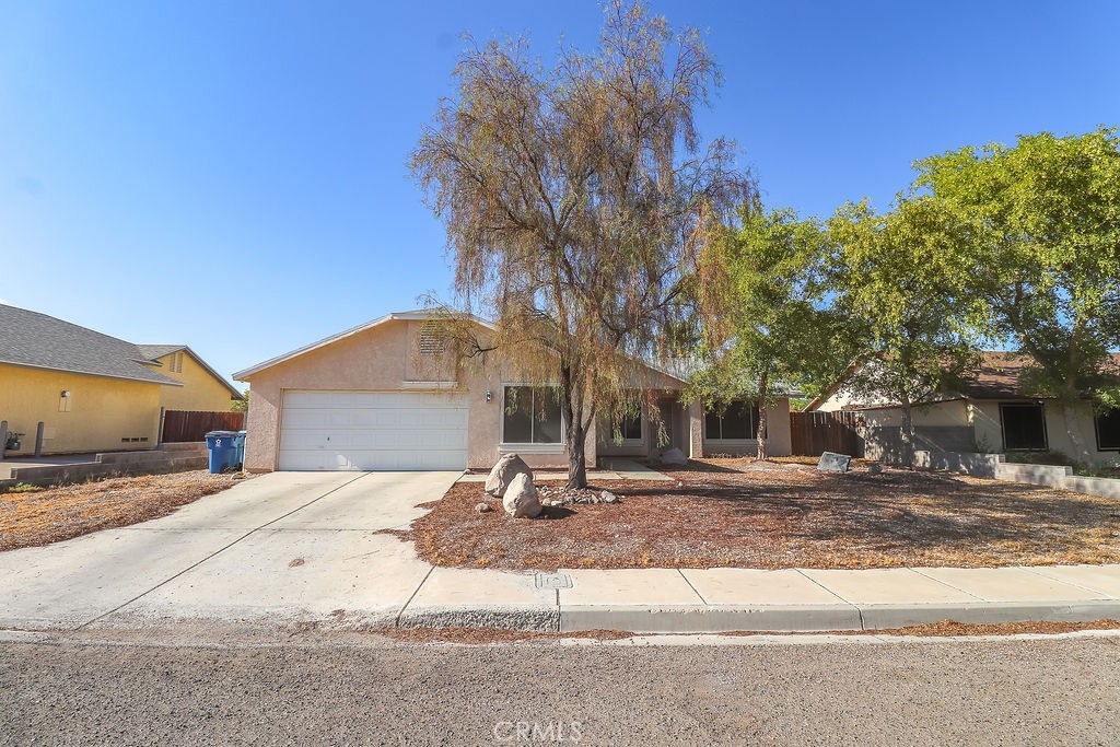 Welcome home!! You will love this adorable 4 bedroom 2 bath home with a 2 car garage. The home features an updated kitchen with new appliances, painted cabinets and granite countertops. Each bathroom has been beautifully finished, with the primary suite bathroom having a newly tiled walk in shower. Newer flooring and paint throughout make this home move in ready for you. Located in a desirable neighborhood and just minutes to the Colorado River. Enjoy the outdoors off-road riding with many trails nearby. You will not want to miss out on seeing this great property.