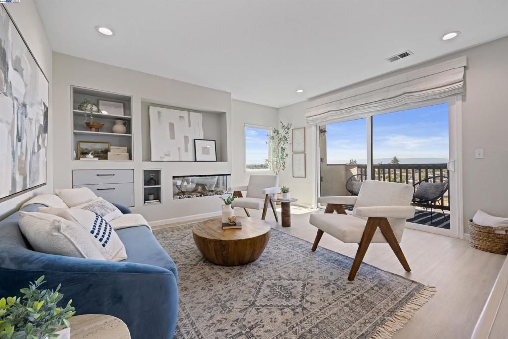 Welcome to Mesa Verde – Living in the Heart of the Bay! This beautifully updated and popular 3-bedroom, 2-bath single-level end-unit condo is tucked into a quiet, private corner of the popular Mesa Verde community, offering abundant natural light, enhanced privacy, and expansive city views. The bright, open-concept layout features new laminate flooring, fresh interior paint, and a cozy electric fireplace. The remodeled kitchen and kitchenette open to one of two brand-new balconies—ideal for indoor-outdoor living and entertaining. The spacious primary suite includes balcony access, a walk-in closet, and a partially updated en-suite bath. Two additional bedrooms offer versatility for guests, remote work, or growing needs. Other highlights include: new dual-pane windows and sliding doors throughout, in-unit laundry hookups, one assigned carport with storage, and an additional parking space. Mesa Verde is a gated community offering resort-style amenities: clubhouse, pool and spa, fitness center, tennis courts, and lushly landscaped grounds. Conveniently located near major freeways, Downtown Castro Valley, CV BART, schools, shopping, and dining.