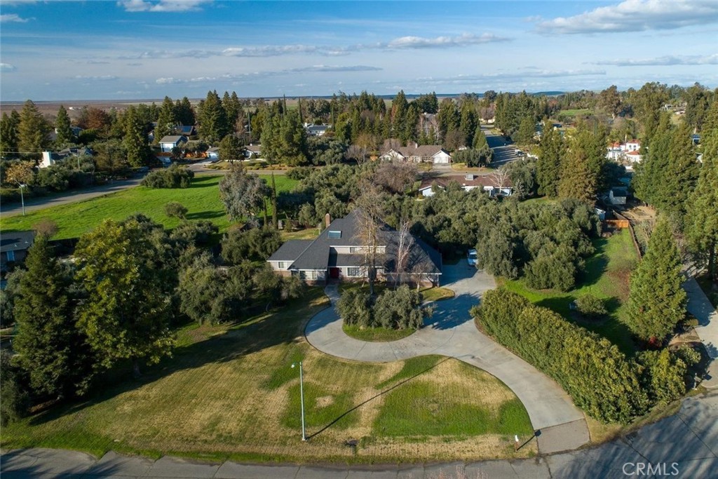 This home sits on approxiimately 1.2A with a Pool on a Cul De Sac. You are minutes from Merced Golf and Country Club and UC Merced. Home is a 5 bedroom (3 upstairs and 2 down stairs) and 3 bathroom (2 upstairs and 1 downstairs). Bedroom has a balcony overlooking huge backyard with Pool. Kitchen has granite counter tops and has an open floor plan into the gathering room with fireplace and has separate dining room and sitting area. Inside laundry room with laundry chute in upstairs bedroom. 3 car garage and a circular driveway.