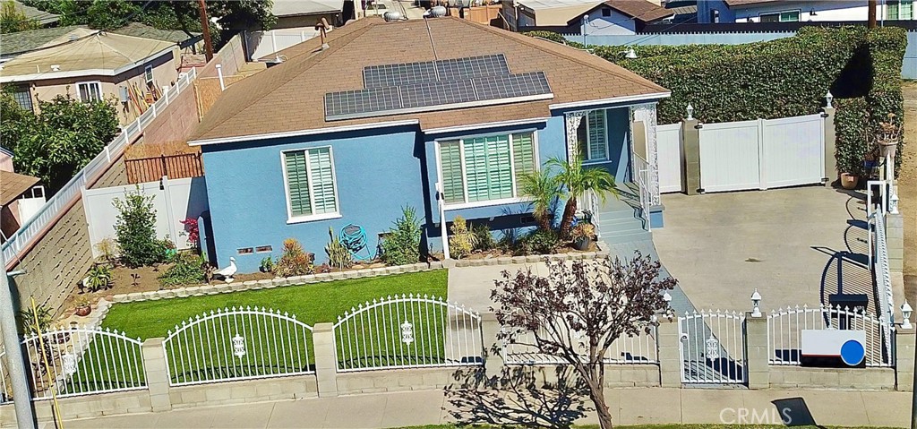 A Charming & Upgraded 2-Bedroom Home with an Expansive an lot. Welcome to this beautifully updated 2-bedroom residence, nestled on an oversized 7,000+ square foot lot—perfect for entertaining, relaxing, or even adding an ADU for extra space or income potential.
Recently renovated interior with fresh paint throughout Gleaming original hardwood floors, professionally refinished. Modern granite countertops in a stylishly updated kitchen. Stackable washer and dryer is included for your convenience. Two efficient split-unit air conditioners for personalized comfort are in the bedrooms. Solar panels were installed to help reduce the electric bills. The Parking & Accessibility includes separate RV parking area. A dedicated Tesla charging station and ample additional parking for guests. It also has a spacious detached 2-car garage. It is a fully gated property for your privacy and security. The exterior has a well-lit exterior for added safety. The expansive lot ideal for gatherings, gardening, or future expansion. The home is in a prime location conveniently situated near the 710 and 91 freeways, offering easy access to surrounding areas and amenities. Seller is highly motivated—don’t miss this opportunity to own a move-in-ready gem with endless potential!