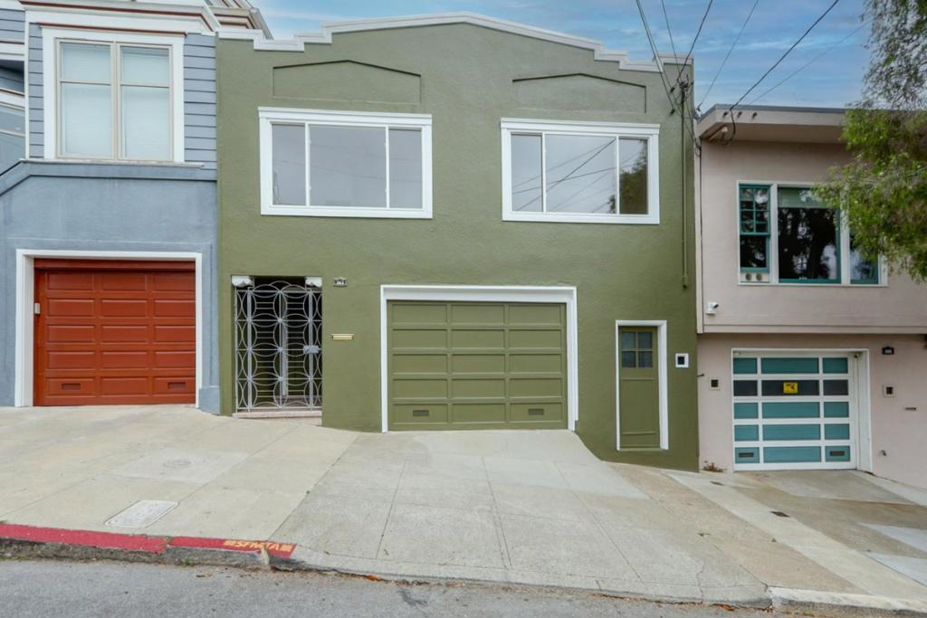 Welcome to your new home in vibrant San Francisco! Just steps from Holly Park & Playground. This delightful residence features a well-designed layout with 3 bedrooms and 1 full bathroom, and 1 half bathroom. The kitchen stands out with modern amenities such as quartz countertops, a dishwasher, an oven range - gas, and a refrigerator. Enjoy hardwood flooring throughout the main living areas, adding warmth and character to the home. Relax by the inviting wood-burning fireplace, making chilly evenings cozy. Additional features include a convenient laundry area in the garage with a washer and dryer. Two garage spaces provide ample parking. When you feel the need to relax to the sound of flowing water, you can step outside to the amazing backyard and sit next to the calming pond and garden area. Don't miss this opportunity to own a piece of San Francisco's vibrant lifestyle with these wonderful amenities!