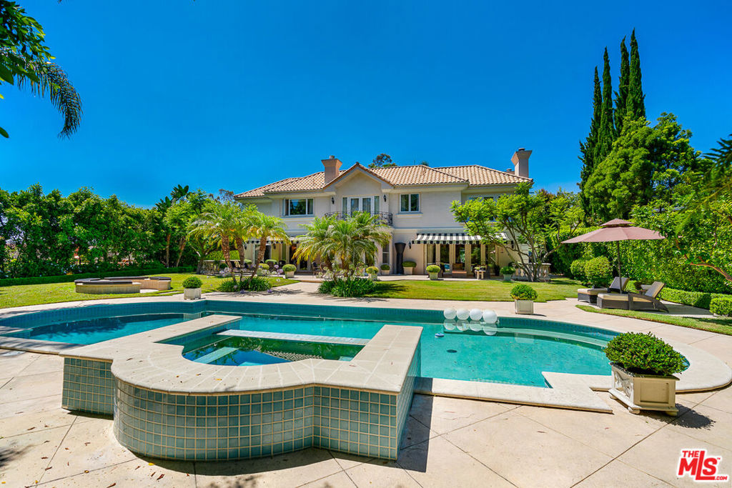 Grand custom built estate nested in 17621 SQFT lot in a cul-de-sac off of Tigertail. This gated beautiful Mediterranean home has 4 bedrooms and 4 1/2 bath , office and a maid quarter. Grand entry, high ceilings, recessed lighting, living room, family room, formal dinning room and a chef's kitchen with stainless steel appliances opening to gorgeous back yard with pool and a spa. Spacious master bedroom with sitting area with view of the magnificent back yard, his and her walk-in closets and beautiful bathroom. Three-Car Garage, and a Gorgeous Oasis View.
