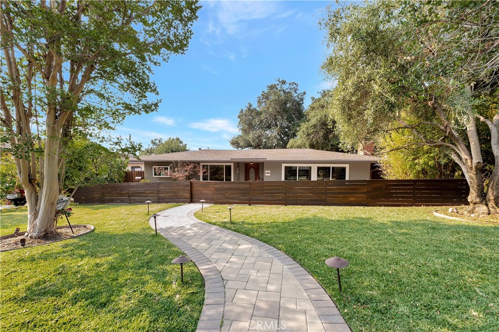 **OFFERS DUE ON WEDNESDAY 8/13 at 10:30PM** Welcome to your dream home in the picturesque foothills of Sierra Madre. This turnkey, single-level residence with 3 bedrooms and 2 bathrooms is a serene, small-town oasis that beautifully combines comfort, elegance, and privacy. Situated on a rare corner lot over 10,500 sq ft, the property boasts an expansive, meticulously landscaped yard featuring high-end paving stones, a desert garden, mature fruit trees, a gazebo, and a custom Brazilian Ipe wood privacy fence enclosing the front yard. Breathtaking mountain views and seamless indoor-outdoor living make this home ideal for entertaining guests, BBQ, and everyday relaxation. Inside, hardwood floors run throughout the home, adding warmth and sophistication. The spacious primary suite is a true retreat, featuring a walk-in closet, private deck, and a luxurious en-suite bathroom with dual shower heads, a double vanity with brand new sinks, and a smart mirror. The custom-designed kitchen is a chef’s dream, showcasing Italian quartz countertops and high-end appliances. Newer dual-pane windows enhance energy efficiency while inviting abundant natural light, beautifully complemented by custom window shades that add both style and comfort. Additional amenities include a large two-car garage, a secured guest parking area (comfortably fits at least 3 additional cars), and a suite of premium appliances and smart home features—refrigerator, chest freezer, smart washer and dryer, water filtration system, custom framed TV, Ring doorbell and floodlight camera, and even a whole house generator for added peace of mind. Don’t miss this rare opportunity to own a one-of-a-kind property that offers luxury, functionality, and tranquility in one of Sierra Madre’s most sought-after neighborhoods.