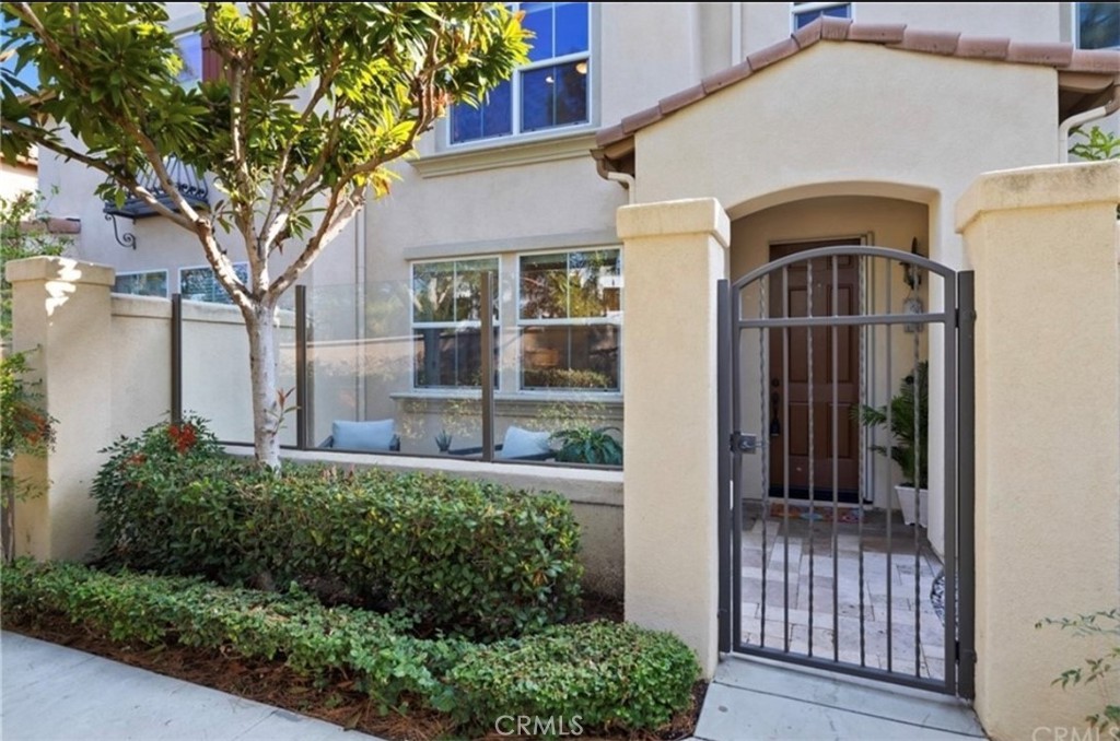 This is it! Located in the sought-after Trailing Vine community, this bright and cheery townhome is ready and waiting for you! 94 New Season features a spacious, open floor plan that includes 3 bedrooms, 2.5 baths, a large two car attached garage, and a loft for a playroom or office space. This townhome has been tastefully updated with luxury vinyl plank flooring, recessed lighting, ceiling fans and a neutral color palette. The charming kitchen has white quartz counters, a sweet subway tile backsplash, stainless steel appliances, and even includes the refrigerator. The tranquil master suite has built-in cabinetry and a walk-in closet with an organizer. It also has an en suite bathroom with double sinks and a separate toilet room. This cozy home is located in a private part of the community, surrounded by mature landscaping and beautiful pine trees - it even has a private, gated front patio. The laundry room is conveniently located upstairs and includes a washing machine and dryer. Central air too. Relax and enjoy the resort-like community pool, spa, grills and children's playground. Easy access to freeways, Tustin Marketplace shopping/dining, Costco, Regional Parks, the Post Office and nature preserves. Top Rated Schools in Tustin Unified School District include Hicks Canyon Elementary, Orchard Hills Middle School and Beckman High.