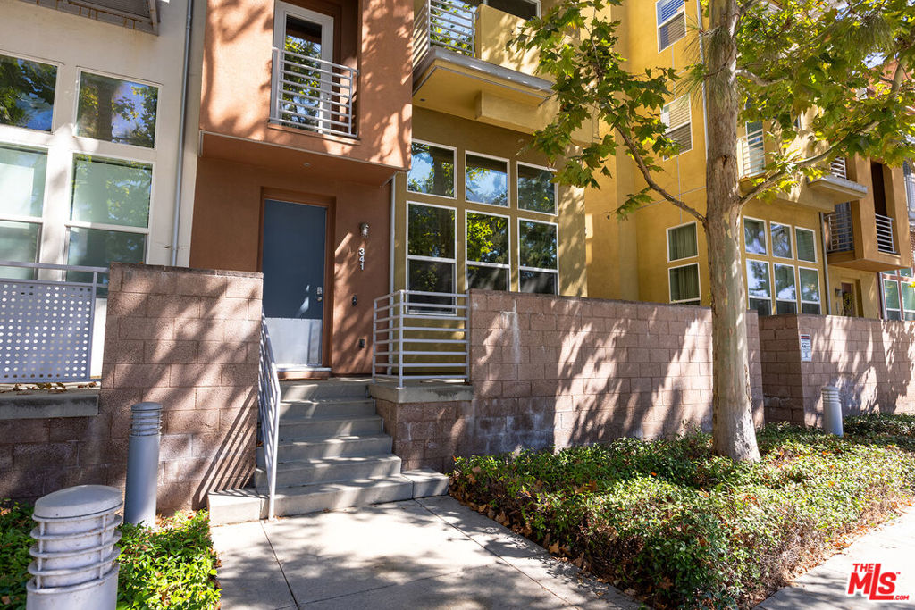 Situated in the heart of City Place, this expansive multilevel residence offers a tranquil retreat blending contemporary design and comfort. As you step inside you're greeted by a formal living room and cozy fireplace. Ascend up the stairs to a well-appointed kitchen and dining area, perfect for entertaining friends and family or relaxing after a long day.On the third level you'll find three well-appointed bedrooms that can fit an array of needs including a home office, workout area, kids' room and more. A full bathroom with a double vanity and a spacious laundry room complete this level. Retreat to the fourth floor dedicated to a luxurious primary suite featuring a light-filled bedroom and private balcony overlooking the park, a generous en-suite bathroom with a soaker tub, and a large walk-in closet. Multiple private balconies across the upper levels of the townhome enhance the living experience, offering delightful outdoor spaces. A private two-car garage provides direct access to the home, adding an element of convenience. For those who love the outdoors, Santiago Park is merely steps away, a 34 acre park that provides a lush escape with a bike trail, tennis courts, playground, picnic area, and more.This townhome is conveniently located to numerous shops and restaurants, walking distance to Mother's Market, Coffee Bean, and Habit Burger Grill and a short drive to MainPlace Mall and the revitalized downtown Santa Ana. Easy access to the 5, 57, and 22 freeways. HOA covers trash and water. Don't miss it!