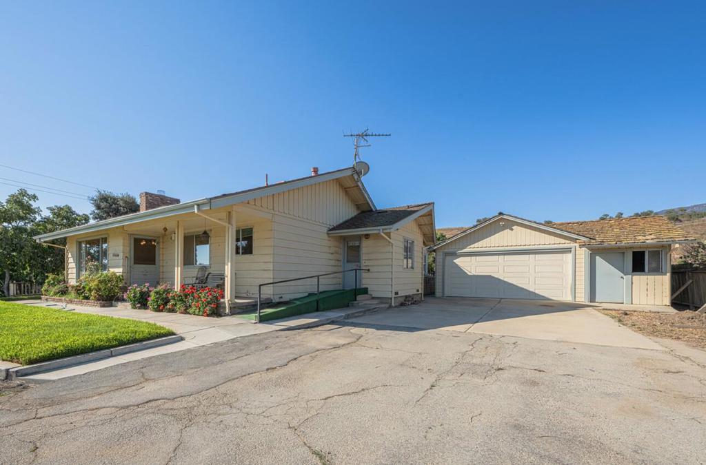 This is a beloved & rare older generational farmhouse - first time ever listed - located on the wine trail, in the popular Mission District of Soledad & nestled on near an acre of useable land, surrounded by active farmland. Boundary survey has been completed, well & septic pump/inspection. Property shows 3/1.5 with an enormous great room, (& wood fireplace) plus a mini study & built-ins attached. (Home was built as a 2/1, 1508 sf in 1950). A live-in kitchen with newer stove & fridge illustrates the old-fashioned style of living, also an outstanding utility room, some newer windows, oodles of storage, front porch, back entertainer's deck, 2+car garage (would make a perfect ADU with an extra storage unit adjacent), basement/cellar & a sweeping driveway up to the property that will make you feel as if you have really arrived! Contact Monterey County for large animal rulings. Buyer to satisfy self of any and all conditions of property, sellers have not resided on the property for decades. Home is livable but with older electrical. Plumbing was updated in 2014. Recorded easement pending for well. Buyer to pay for any additional inspections. Agents/sellers do not guarantee any details of listing/buyers to satisfy selves. Owners have not lived on the property since they were children.