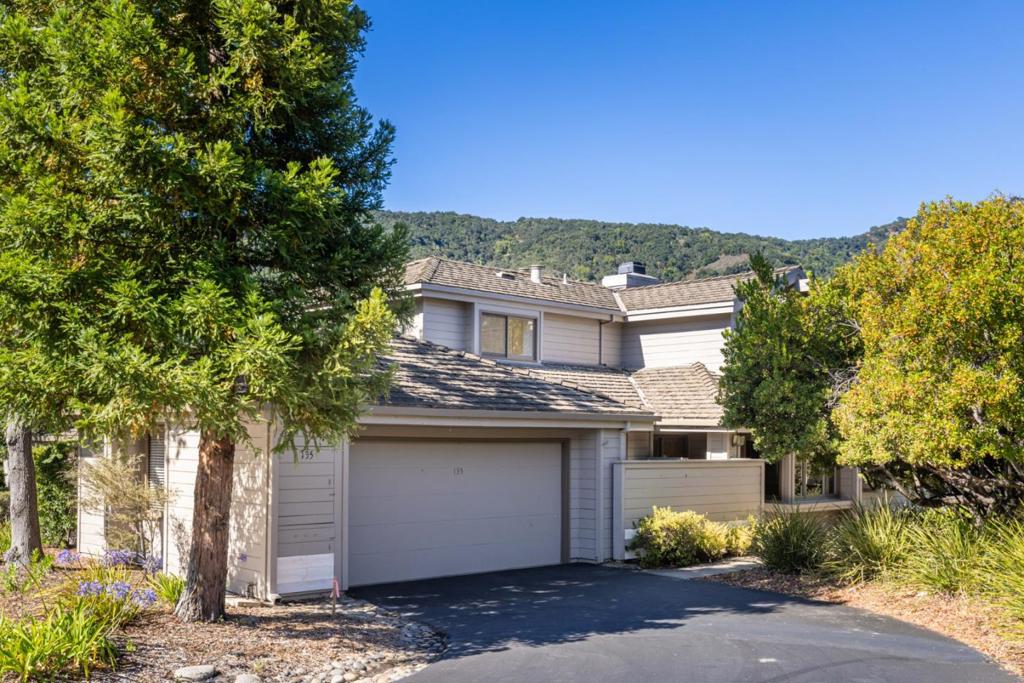 Enchanting White Oaks Condo complex in the heart of Carmel Valley Village...Large 2,165 sf Condo located at the apex of the complex on the inner circle with breathtaking mountain views and very private setting. On the market for the first time in 23 years. Master suite downstairs with sliding door to private courtyard. Second level Loft can be used as a den, office or hobby area adjacent to the second bedroom suite. Living room with tall, vaulted ceilings, gas starter wood burning fireplace, built in bookshelves, large windows with astonishing views of the mountains, and sliding door to very private rear fenced mountain view Deck. Formal dining area adjacent to living room and kitchen with large, mountain-view windows. Large open kitchen with Peninsula counter for cooking large meals and adjacent large casual dining room both in refinished hard wood floors. New carpets, new paint, new stainless steel appliance suite, new electrical panel, new compliant toilets, and finished two car garage. Small quite complex with only 30 units has Clubhouse and Pool.
