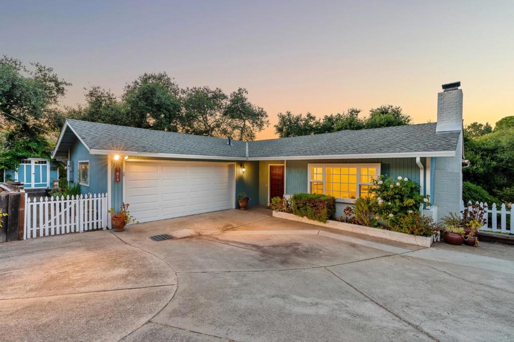 Welcome to 514 Noteware Drive, an exceptional 4BD/3BA home offering 1,905 sq ft of beautifully updated living space on an 11,021 sq ft lot in a peaceful Ben Lomond neighborhood. Enjoy refinished solid oak floors, an open layout, and a modern kitchen with quartz counters, high-end appliances, island seating, and a built-in desk area. The inviting living room features recessed lighting and a cozy wood-burning fireplace. All bathrooms have been tastefully remodeled with timeless finishes. The primary suite includes a walk-in closet, spa-like bath, and access to a private deck with stunning valley and mountain views. The split-level design offers single-level living upstairs, while the lower level features a bedroom, full bath, bonus kitchenette, and slate floors. This space is ideal for multi-gen living or rental potential. The large, flat backyard is perfect for play, parties, and gatherings, surrounded by fruit trees and mature landscaping with drip irrigation. Extras include two sheds, a finished bonus space with exterior access, and modern upgrades: electric car charger wiring, dual-pane windows, central heat & A/C, and a generator switch. City water, natural gas, and a serene location close to town complete this rare offering.