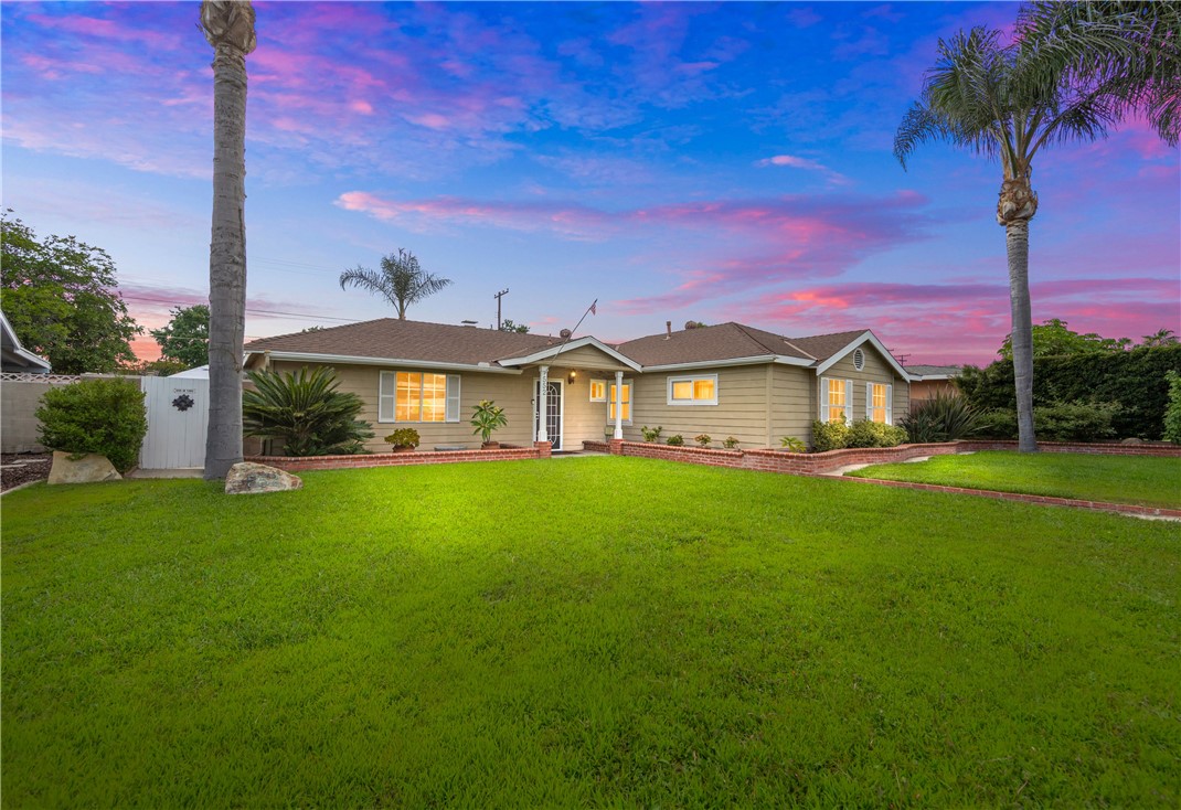 Welcome to 552 Yorba Street, a beautifully upgraded 3-bedroom, 2-bathroom home in one of Orange’s most desirable neighborhoods. This well maintained residence offers the perfect blend of timeless character and thoughtful modern updates. This home is great for car enthusiasists!
Step inside to a bright, open floor plan with recessed lighting, engineered hardwood flooring, and neutral earth-tone paint that enhances the natural light streaming through dual-pane vinyl windows. The heart of the home is the elegant, fully remodeled kitchen featuring granite countertops, rich cherry wood cabinetry, glass and travertine backsplash, and stainless steel appliances—a dream for any home chef.
Enjoy relaxed meals in the dining area overlooking a generously sized backyard, freshly landscaped with lush green grass—perfect for barefoot afternoons, outdoor entertaining, or future expansion. Both bathrooms have been tastefully remodeled with quality materials, and a long list of recent upgrades ensures peace of mind for years to come, including: roof is in good condition. Central heating and A/C. Updated lighting fixtures. Finished garage with carport access—ideal for a home gym, bonus space, or future ADU conversion. Long gated driveway offering ample parking and alley access to the attached 2-car garage. Neighborhood & Lifestyle Perks: Attends Esplanade Elementary, Portola Middle School, and Orange High School (Orange Unified School District). Just minutes to Old Towne Orange, The Village at Orange, and shops like Trader Joe’s, Target, and Sprouts. Convenient access to the 55, 22, and 91 Freeways, making it easy to reach Anaheim, Irvine, and coastal destinations. Whether you're enjoying quiet mornings under the shade trees or hosting summer barbecues in your spacious backyard, this home offers a lifestyle of ease, style, and community.