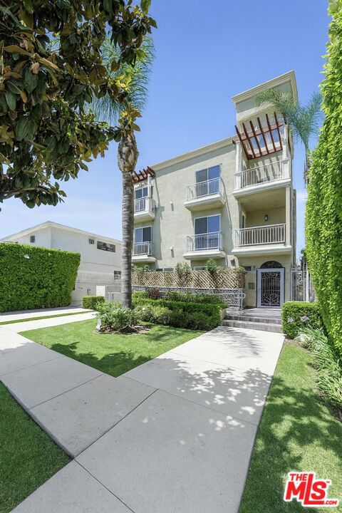Sophisticated Hollywood Hideaway with Private Patio Experience the perfect blend of style, comfort, and convenience in this updated 2-bedroom, 2-bath residence, set within an intimate 6-unit building in the vibrant Hollywood Media District. Spanning approximately 1,320 sq. ft., this home offers a bright, airy layout ideal for both relaxing and entertaining.The open-concept design features wide-plank luxury flooring, crisp white walls, and oversized windows that invite an abundance of natural light. The upgraded kitchen boasts granite countertops, custom cabinetry, stainless steel appliances, and a picturesque window over the sink, allowing fresh breezes to flow through. A full-size LG washer and dryer are discreetly hidden behind louvered doors near the entry, while smart home featuresincluding a Nest thermostat and modern light controlsadd comfort and efficiency.The primary suite offers a spacious walk-in closet and a spa-like en-suite bath, while the second bedroom works beautifully as a guest room, home office, or creative space. The renovated guest bath is conveniently located off the hallway. Step outside to your private, enclosed patio perfect for dining al fresco, grilling, or simply unwinding.Additional amenities include two tandem gated parking spaces, guest parking, elevator access, and a dedicated universal EV charger. Located just moments from Gold's Gym, the Arclight, Netflix, W Hotel, trendy new restaurants, and the Hollywood Walk of Fame, this secure and quiet building offers a rare combination of privacy and accessibility. Ideal for professionals, retirees, or couples seeking a stylish home in one of LA's most dynamic neighborhoods. Low HOA'S