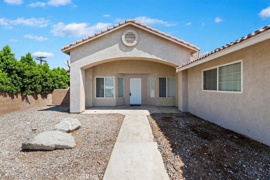 This inviting 1,837 sq. ft. home, built in 2005, offers comfortable living with beautiful desert mountain views. The open floor plan features attractive plank-look tile flooring in the main living areas and warm wood-look laminate in the bedrooms, providing easy, low-maintenance style throughout. High volume ceilings add a spacious feel, while a cozy fireplace creates a welcoming focal point.

The bright, well-appointed kitchen is equipped with polished granite countertops, stainless steel appliances, a breakfast bar with pendant lighting, and generous cabinet space. The spacious primary bedroom includes a walk-in closet, double sinks, and an updated bath surround for a fresh, modern touch. Two additional bedrooms and a full guest bath offer flexibility for family, guests, or a home office.

Enjoy the outdoors from the covered front porch or the private, block-walled backyard with a roomy patio—perfect for relaxing or entertaining. Additional features include a two-car garage, central air, and a durable tile roof. Located in the desirable Wardman Heights area, just a short drive from Mission Lakes Blvd.ocated j Located just north of Palm Springs, Desert Hot Springs is renowned for its naturally occurring hot mineral springs. The area features luxurious resorts and wellness spas that draw from these geothermal aquifers, offering a unique desert retreat experience.