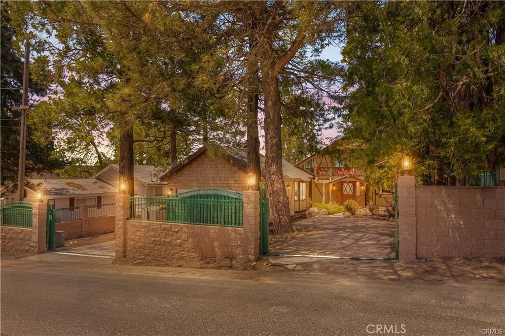 Escape to peace and privacy in this beautifully appointed 4-bedroom, 2-bathroom mountain home, located in the highly desirable Nob Hill community of Running Springs. Nestled within the stunning San Bernardino National Forest, this 2,119 sq. ft. property offers unparalleled panoramic views of the surrounding mountains and treetops—perfect for those seeking both tranquility and natural beauty.
Set on a spacious lot, the home features two gated entrances, including an automatic gate for secure and convenient access. The property also offers RV parking potential and extra parking ideal for adventurers and visitors alike.
Step inside to find a warm and inviting living space, complete with a cozy fireplace, a rejuvenating sauna, and a versatile loft that can serve as a home office, creative studio, or extra lounge area. Mature apple trees adorn the grounds, offering a delightful seasonal harvest and enhancing the home’s rustic charm.
With ample basement storage and thoughtful details throughout, this home is both functional and full of character. Whether you're looking for a full-time residence, vacation home, or investment opportunity, this Nob Hill gem provides exceptional privacy, stunning views, and a coveted location in one of Running Springs’ most sought-after neighborhoods.
Don’t miss the chance to make this serene mountain escape your own!