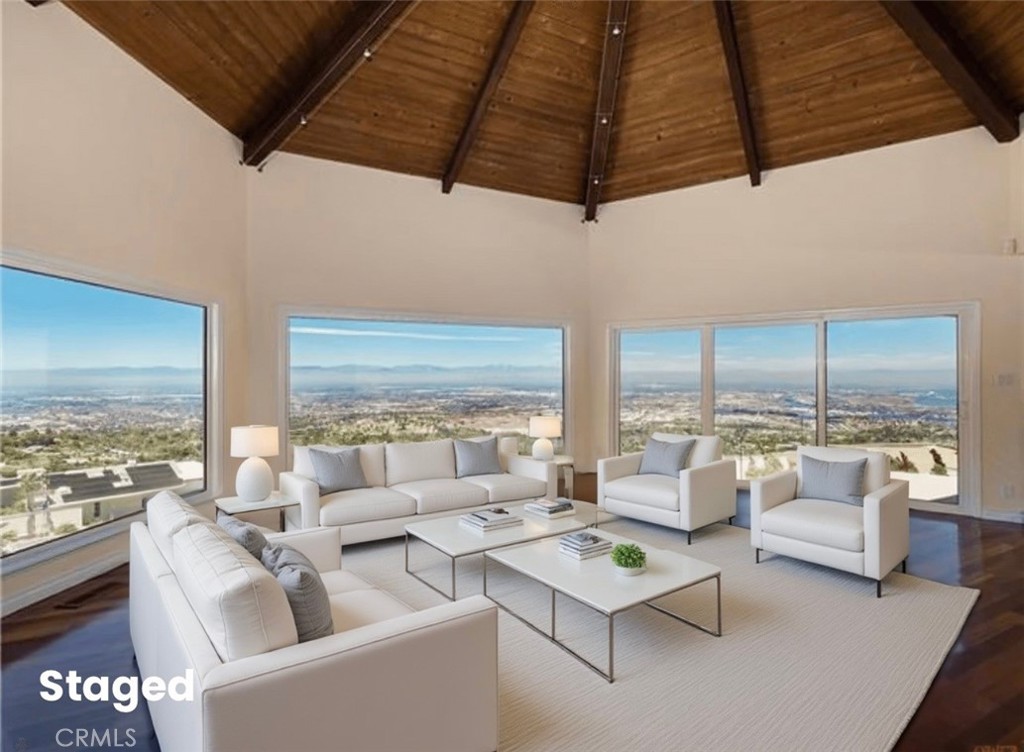 Absolutely amazing view!! This gorgeous 4-bedroom contemporary home will treat you, your family and guests to an amazing panoramic view from Malibu to Long Beach from nearly every room in the house. A WALL OF GLASS GREETS YOU AS YOU ENTER THE HOME EXPOSING THE MOST JAW DROPPING VIEWS. Spacious and modern, the open floor plan and completely remodeled island-style kitchen with custom soft-touch close cabinets make this home perfect for entertaining. Further amenities include: stainless steel built-in appliances, cherry wood floors throughout including plank cherry wood stairs, double-pane windows, double glass doors for the main entrance, a 3-zone high-efficiency heating and central cooling system, interior and exterior glass railings to maximize view from all rooms, recessed 4-inch lights with dimmer controls, high vaulted ceiling, three gas fireplaces and a wet bar. Plus, there are two patios and one large deck where everyone can enjoy the beautiful sunset views. There are custom built-in closets with ample storage both in the home and garage. Residents have access to the top ranked Palos Verdes Schools such as Mira Catalina Elementary, Miraleste Intermediate, and your choice from two of the top ranked high schools in California. A must see, this listing will not last long!