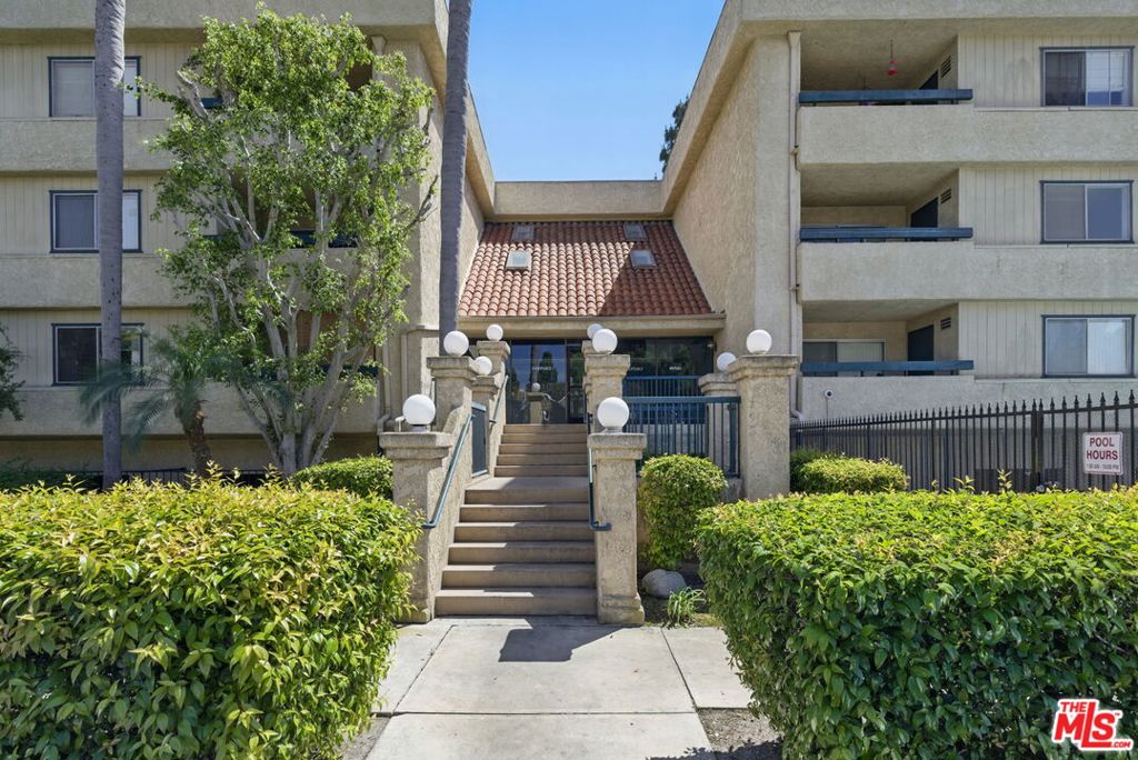 Situated just steps from Historic Main Street and next to Village Green Park, this well-kept second-floor unit is within walking distance of City Hall, the Police Department, Costco, and numerous shops and restaurants. Spanning 1,254 sq. ft., the condo features 2 bedrooms, 2 full bathrooms, and two private balconies. The spacious living room, dining area, and breakfast counter create an open, inviting layout. The unit includes new carpet, fresh paint throughout, and a walk-in closet in the master bedroom. Enjoy central AC and heating, as well as a washer/dryer conveniently located near the entrance. Additional features include a fireplace, ceiling fans, a built-in microwave, and two assigned parking spots. The community offers a pool, spa, and HOA coverage for water, trash, exterior building insurance, along with convenient visitor parking. This is an opportunity you won't want to miss!