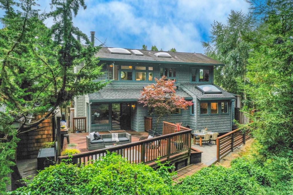 Discover this two-bedroom Aptos treasure blending a whimsical mix of artisan and craftsman styles with rustic, and coastal bungalow overtones. Tucked away in a quiet neighborhood that surrounds the Aptos Polo Grounds and backing to the Valencia Creek corridor, this quaint, and welcoming abode highlights real wood flooring, cozy fireplace, a delightful kitchen & custom cabinetry. A pitched roof with an open beam ceiling upstairs offers a feeling of openness. Advantageous exposure brings in abundant, all-day natural light through a myriad of attractive windows and skylights. A wonderful back deck, new patio, and fencing create a serene setting for relaxation and entertaining with a backdrop of redwoods. Location offers quick, easy access to all the best of Aptos. Walking distance to favorites such as The Hideout and Cavalletta. It's a short trip into the quaint and evolving Aptos Village featuring New Leaf Market, Mentone, Aptos BBQ, Penny Ice Creamery, Cat & Cloud Coffee, and of course, the majestic Forest of Nisene Marks, which is ideal for strolling, running, hiking, and world-class mountain biking. Seacliff, Seascape, and expansive South County beaches are within a short drive. Quick highway access is just around the corner. Truly, a special home. Come see!