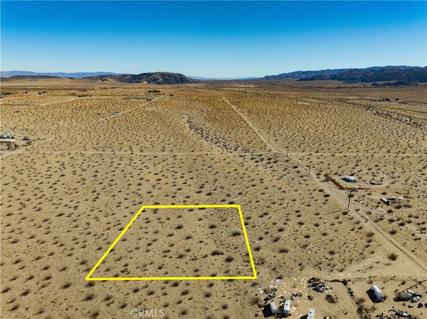 (Address is fictitious and used for marketing) Discover your slice of desert paradise on this 1.25-acre lot in Joshua Tree, offering mountain and expansive desert views. This flat terrain is perfect for a smooth building experience, whether you're envisioning your dream home, a vacation retreat, or an investment property. ADJACENT PARCEL is also for sale.

The parcel is accessible via an unpaved road, with power lines conveniently running along the property for easy connection. The nearest water source appears to be located at 2 Mile Road and La Ferney Avenue, providing practical options for future development.

Nestled in a serene setting, this residentially zoned lot provides the perfect blend of privacy and proximity, just a short drive from Joshua Tree National Park and local amenities. Don’t miss the chance to create something extraordinary in this sought-after desert community! 

(GPS 34°08'48.7"N 116°16'02.9"W)