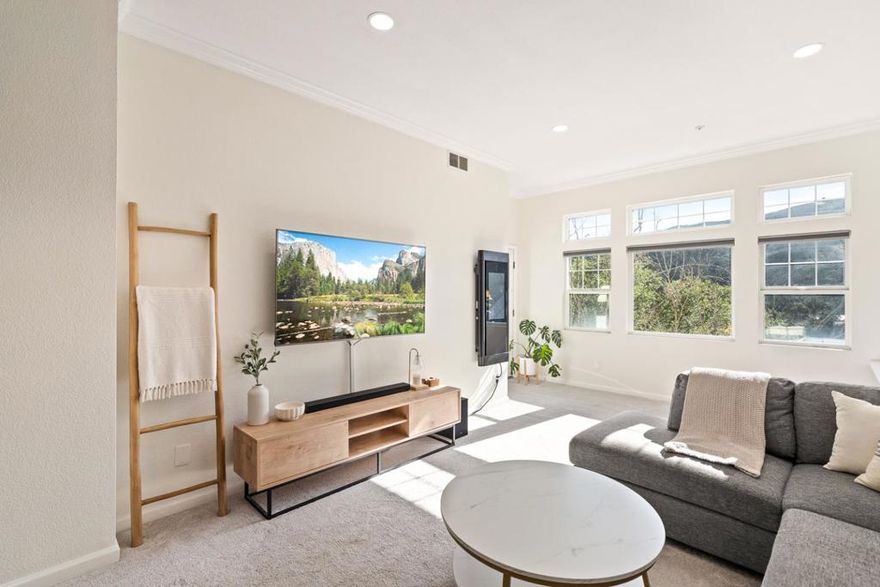 Welcome to 833 Swallowtail Court, a beautifully updated 2-bedroom, 2-bathroom condo in the peaceful hillside community of Brisbane. This bright, single-level home blends modern upgrades with an inviting, functional layout. The spacious living room features large windows, natural light, recessed lighting, and an open area ideal for dining. The updated kitchen includes modern cabinetry, quartz countertops, a stylish backsplash, stainless steel appliances, and a peninsula with breakfast bar seatingperfect for casual meals and entertaining. Both bedrooms offer plush carpeting and great natural light. The main bedroom includes recessed lighting, ample closet space, and direct access to a private balcony with serene mountain views. Its ensuite bathroom features an upgraded double-sink vanity, modern lighting, and a shower-over-tub with a sleek glass panel. The second bedroom is perfect as a guest room, additional bedroom, or home office, with an updated second bathroom nearby. A dedicated laundry area with washer and dryer adds convenience, along with two designated parking spaces. Located in a well-maintained community near parks, trails, shopping, and dining, this home offers comfort and accessibilityjust minutes from San Francisco, SFO, and Highway 101.