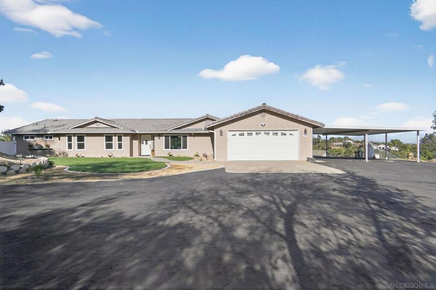 Beautifully remodeled home on over 2 acres with stunning views.  Perched at the end of a quiet cul-de-sac, this spacious home offers panoramic valley and mountain views from nearly every angle.  Inside you will find four oversized bedrooms, including a luxurious primary suite with two expansive walk-in closets and upgraded spa-like bath with separate makeup vanity. The gourmet kitchen features newer stainless appliances, quartz countertops, and a massive island-perfect for entertaining.  Fresh interior and exterior paint, new windows, new luxury vinyl flooring, along with crisp landscaping, make this home move-in ready. The exterior offers plenty of space with over 2 acres, a covered motorhome carport with hook-ups, additional 3-stall carport, oversized 2-car garage, and a 50x16 detached workshop with roll up door.  There's room for horses, vineyard, toys, an ADU, and more.  A truly exceptional property that blends privacy, functionality, and breathtaking views.