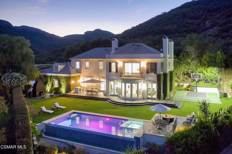 Discover the art of refined living in this beautifully reimagined 5,226 sq. ft. residence, perfectly positioned along the fourth hole of the prestigious Lake Sherwood Golf Course. Set within the exclusive guard gated community of Lake Sherwood, this stunning six bedroom, five bath estate captures sweeping fairway and hillside views, offering an unparalleled blend of natural beauty, privacy, and sophistication.Designed for both grand entertaining and effortless everyday living, the home showcases a magnificent great room with soaring ceilings and expansive picture windows that flood the space with natural light. The chef's kitchen is a statement in craftsmanship and style, featuring top of the line appliances, custom cabinetry, and refined finishes throughout.The primary suite is a private sanctuary with a spa inspired bath, a serene balcony overlooking panoramic views, and elegant design details that elevate every moment. Each additional bedroom is generously appointed, offering comfort and space for family or guests.Outdoors, indulge in the ultimate California lifestyle with lush, manicured grounds, a private infinity edge pool, a luxury outdoor kitchen, and a versatile sport court, all set against the breathtaking backdrop that defines Lake Sherwood living.A seamless blend of timeless elegance and modern luxury, this exceptional Lake Sherwood estate embodies the very essence of elevated living, where every view inspires and every day feels like a getaway.