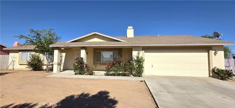 Photo of 14307 Tonikan Rd, Apple Valley, CA 92307 (MLS # IV26092694)