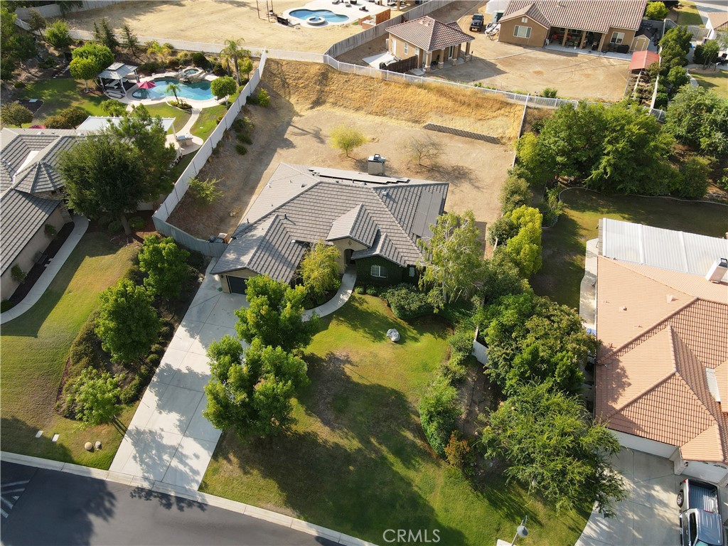 Beautiful Home in the Gated Tuscany Community! Welcome to this beautiful 4-bedroom, 2-bathroom home with a 2-car garage, located in the desirable Tuscany neighborhood. Step inside to find a formal dining room illuminated by an elegant chandelier, and an open-concept great room complete with a fireplace perfect for entertaining or relaxing evenings at home. This lovely kitchen boasts abundant cabinet space, a pantry, and a breakfast nook. Enjoy the convenience of an indoor laundry room and generously sized bedrooms. The fourth bedroom, currently used as an office, features double doors and a closet, offering flexibility to suit your needs. The primary suite includes private access to the backyard, a full bathroom with dual sinks, a walk-in closet, and two additional closets for ample storage. Step outside to the expansive backyard ready for your personal touch and perfect for adding a pool or creating your dream outdoor retreat.