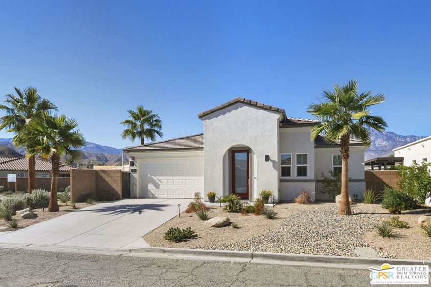 Welcome to the Villages at Rio Del Sol. Stunning 2 bedroom, plus a DEN and 2.5 baths located in the heart of the desert, on a corner lot. This property is ready to move in! Don't miss the gourmet kitchen with quartz countertops, gorgeous full backsplash, stainless appliances, 5-burner gas stove top, single basin stainless sink, Shaker cabinetry, pantry closet, and a large island with a breakfast bar. The Primary Suite is spacious and boasts 2 walk-in closets. One of the Primary walk-in closets is very spacious and has a window, the Sellers carved out some space for an office, complete with bookshelves and a desk area. The Primary Bath has a double vanity, walk-in shower and more quartz countertops. The gas fireplace has an electronic switch starter. Upgraded recessed ceiling art lighting has been added and the shades in the great room/dining areas and Primary suite are automated with remotes. Upgraded Lutron dimmers and switches throughout. There is a formal entry. Other perks and upgrades include owned Solar system, tankless water heater, epoxy (oversized) garage floor and a water purification system. The garage also features full sized storage cabinets and a work bench with a pegboard. There is a laundry room with a sink, Piedrafina countertops and cabinets for storage. This home is wired for an alarm system, including camaras and there is a fire sprinkler system. Flooring consists of 36" ceramic tiles and designer carpets in the bedrooms and in the Den/TV room. The landscaping is low maintenance with desertscape in the front (maintained by as a part of your HOA dues), and more desert landscaping in the back yard along with artificial grass. A large, west facing, covered patio anchors the back of the house. The Villages is a great value considering the HOA dues and land lease amount, square footage, overall quality and community amenities, and well suited for anyone wanting an active lifestyle. Community is guard gated during the day. This Plan 1 with an open great room has been expertly appointed and finished by an Interior Designer, beyond the builder upgrades. Don't miss out on this very special property.