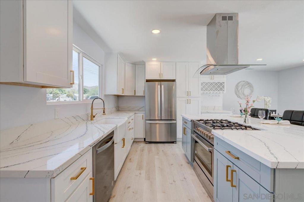 Welcome to 14543 Kittery, a beautifully renovated 3 bedroom, 2 bathroom home located in the highly sought-after neighborhood of Poway. Situated just minutes from major shopping centers, top-rated schools, and the picturesque Old Poway Park, this home offers an unbeatable combination of comfort, style, and convenience. Once you step inside you'll discover an open and airy floor plan, where natural light flows effortlessly throughout the home. The freshly updated interior features stunning new luxury floors, sleek modern finishes, and brand-new windows that enhance both the aesthetics and energy efficiency of the space. The heart of the home is a bright, welcoming kitchen with a huge island, perfect for your morning routine or entertaining guests. The large front and back yard provides ample space for outdoor activities, gardening, or simply relaxing in the sunshine, while the overall modern touches throughout the home ensure you’re living in style. The home also features a PAID solar system for little to no electricity bills, and the potential for an ADU in the large backyard. Don’t miss this opportunity to own a move-in-ready home in one of Poway’s most desirable locations.