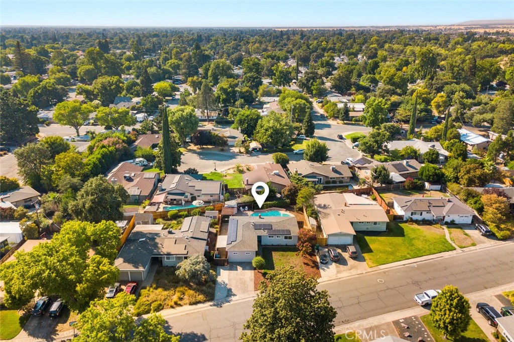 Live where Chico shines brightest! Just blocks from the trails and natural beauty of Bidwell Park and within the highly sought-after Sierra View Elementary school district, this beautifully updated home puts outdoor adventure and top-rated schools right at your doorstep. Step inside to fresh interior and exterior paint, refinished kitchen cabinets, and a bright, welcoming atmosphere. Enjoy peace of mind with owned solar and a new roof installed in 2021. Outside, a newly replastered and re-tiled pool, relaxing spa, and low-maintenance landscaping create a backyard you’ll never want to leave. Lounge under the pergola, store your gear in the pool shed, and savor your own fruit-bearing grape vines. The converted garage adds a versatile bonus space perfect for a home office, gym, or media room. This home is truly move-in ready! From its prime location to its backyard made for relaxing and entertaining, this is the Chico lifestyle you’ve been waiting for.