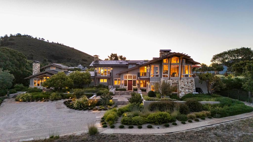 Welcome to this stunning California Modern home artfully designed by award-winning architect David Martin, set on an immaculate 6.1-acre estate within the exclusive gated community of Teháma. Seamlessly integrated into the natural surroundings, this Silver LEED Certified residence spans 8,199± square feet, offering a luxurious retreat just 8 minutes to downtown Carmel. Enjoy breathtaking views of Carmel Valley and the ocean from almost every angle. This exceptional property features a main house with four bedrooms, an elevator, a billiard entertainment area, wine cellar, and a connected guest house with its own full kitchen. The open-concept design invites the outdoors in, with expansive entertaining spaces enhanced by a swimming pool and hot tub overlooking Carmel Bay, fountains, a fire pit, an outdoor kitchen with a fireplace, bocce court and a serene rose garden. Natural light pours through ridge skylights and floor-to-ceiling corner windows, highlighting the exquisite designer finishes throughout. Ideally located just 4 minutes (0.8 miles) from the Carmel Valley gate, this property is a stunning masterpiece that exemplifies the seamless blend of architectural brilliance and the natural beauty of its surroundings.