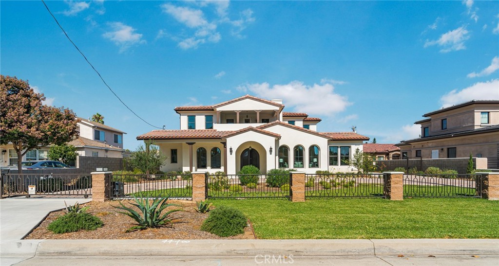 EXQUISITE BRAND-NEW CUSTOM HOME IN THE PRESTIGIOUS TEMPLE CITY NEIGHBORHOOD! This elegant two-story Spanish-style residence has a great curb appeal with a beautiful circular driveway, featuring 5 bedroom, 5.5 bathrooms offering 3,782 square feet of luxurious living space suited on an oversized 16,200 square feet lot. The spacious front porch takes you into a grand double door entry into foyer leads you to a stunning living room connects to a stunning formal dining room, and a private home office/library. The home has two kitchens, a chef's dream wok room for culinary enthusiasts and a gourmet kitchen which is an open concept with quartz center island counter top, modern and updated stainless appliances and cabinets with lot of storage, and a walk-in pantry for added convenience. Enjoy the seamless open floorplan between kitchen, wet bar, breakfast nook area connects to a large charming family filled with natural light through the double sliding door and overlooks the lush landscaping. This bright and versatile seamlessly combines functionality and refinement. The custom beautiful wrought iron staircase leads to second floor features the luxurious master suite, a true retreat with a generous walk-in closet and a spa-inspired bathroom, complete with a soaking tub, separate shower, and dual-sink vanity. All En-suite bedrooms offering a private sanctuary for rest and rejuvenation. Modern light fixtures, crown moldings, tilts and hardwood throughout the interior. A cozy balcony upstairs is a perfect sitting area overlooking the front view of the home. Solar system for energy savings has been paid off. Large private backyard creating the perfect setting for outdoor dining or family entertaining. This remarkable property combines modern comfort with timeless elegance, making it the perfect place to call home. Don't miss the opportunity to experience the peaceful lifestyle offered by this custom brand new home.